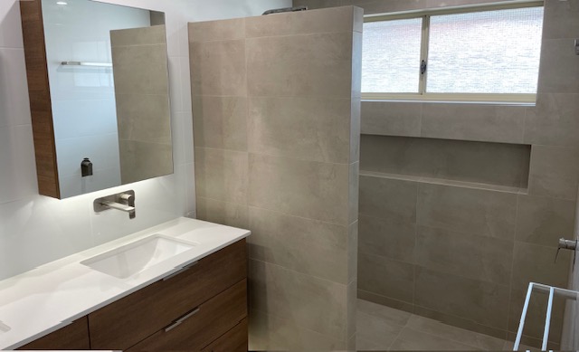 Ensuite with niche and backlit mirror cabinet